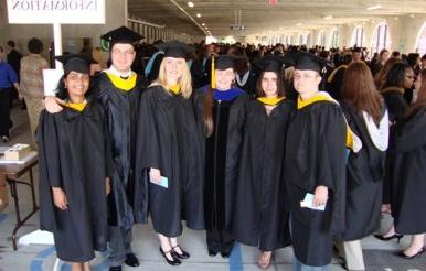 Physics masters students getting ready for commencement